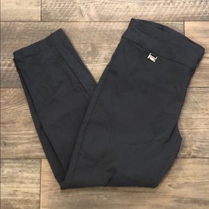 Grey colored tummy-control trouser pants.